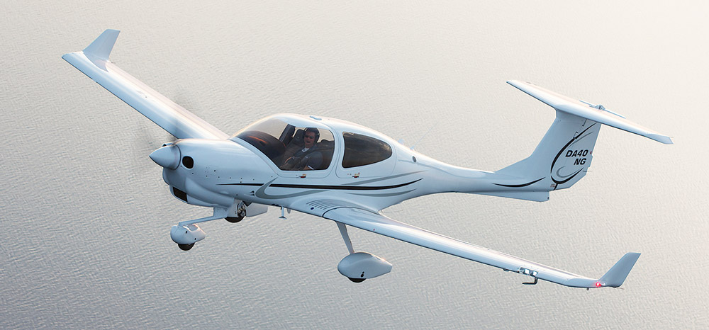 A Diamond DA40 training aircraft over the sea